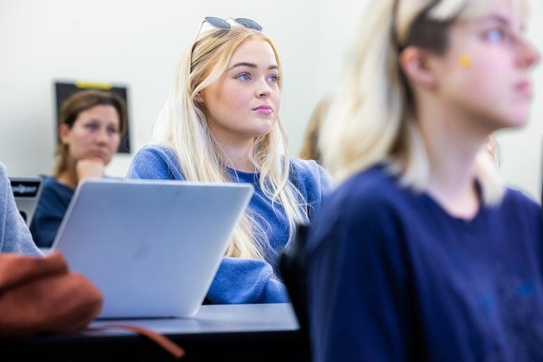 Wilkinson College student listening intently to lecturer